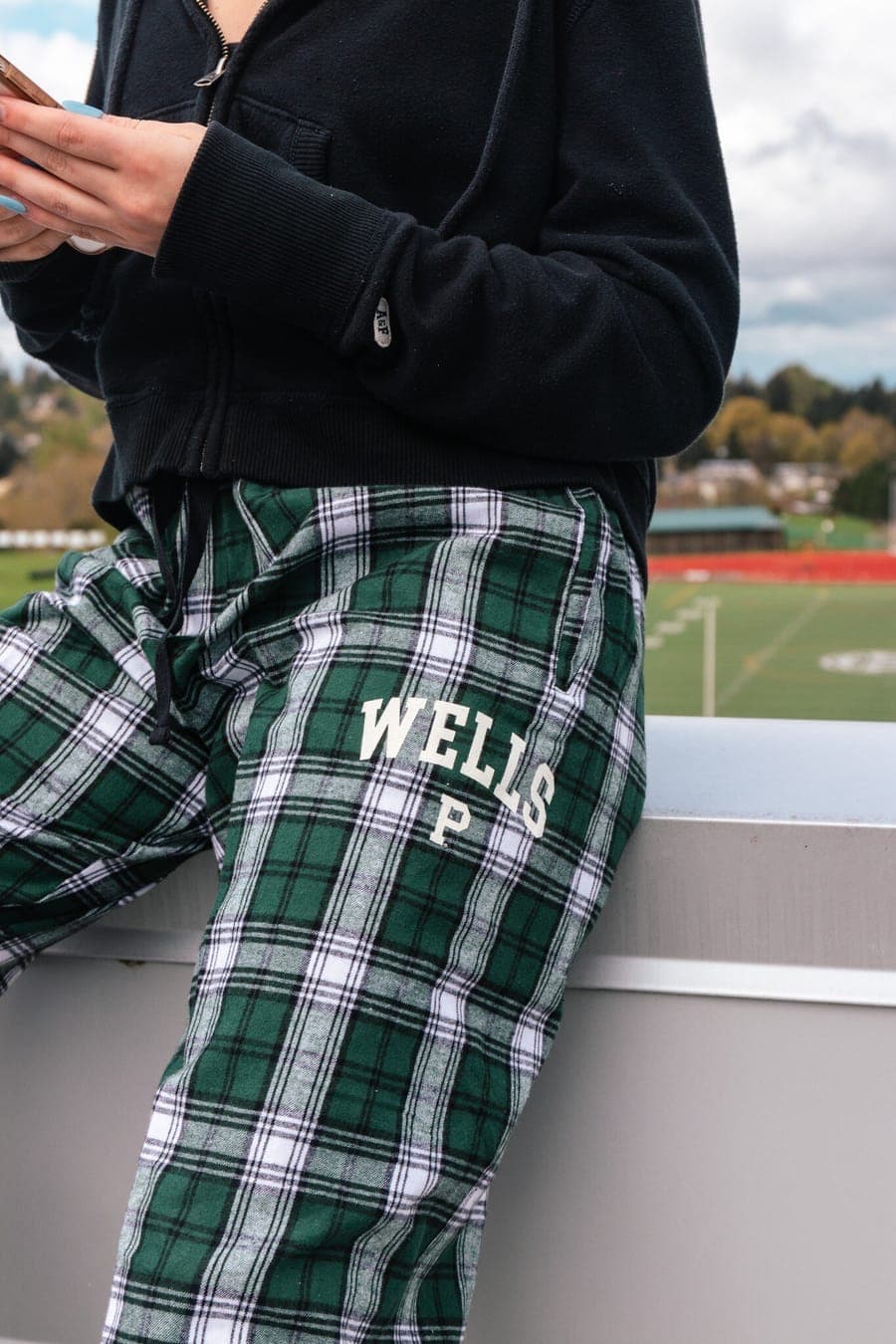Close-up of the green plaid Wells flannel pants with the P mark